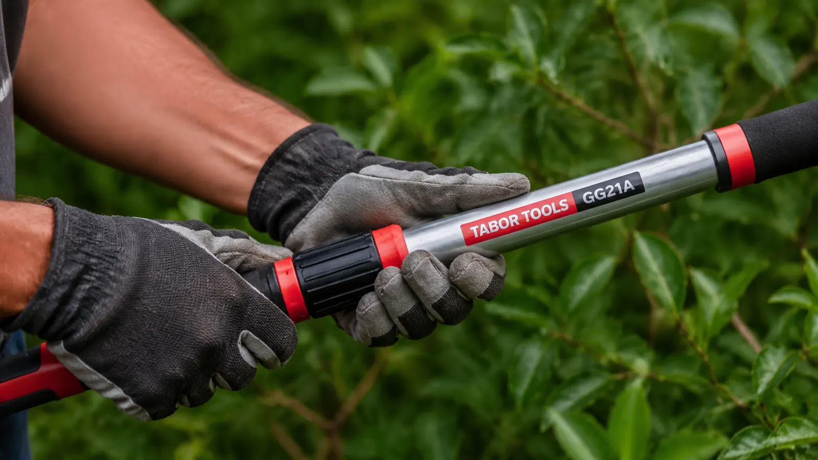 Hands in garden gloves adjusting the twist-lock collar on a telescoping lopper handle mid-task